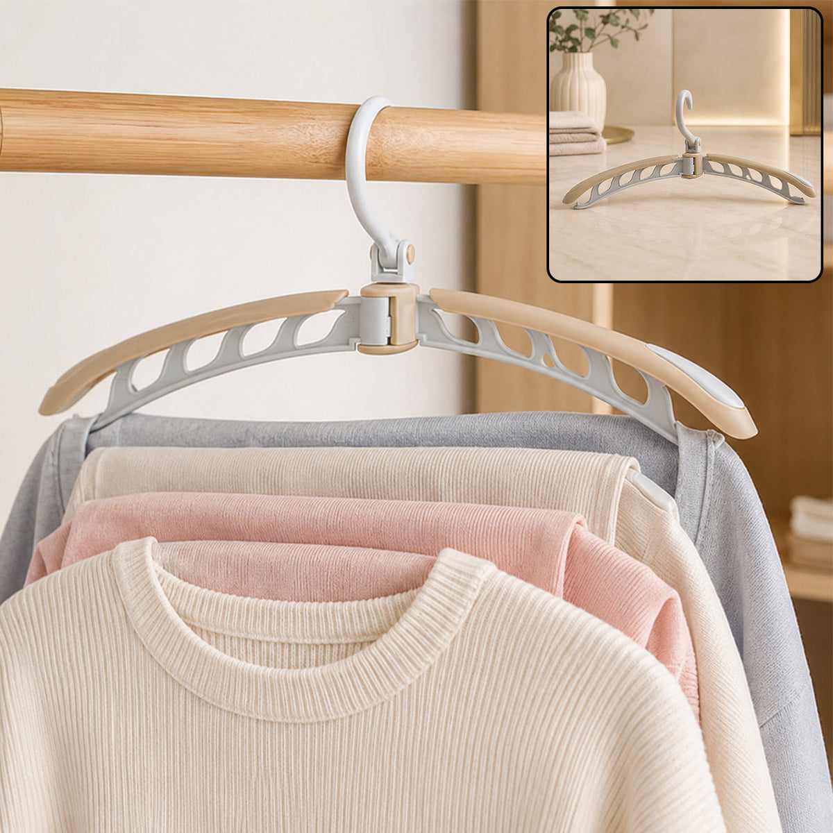 A beige and white folding hanger holding a cream sweater and light colored pants on a wooden rail. Inset shows the hanger