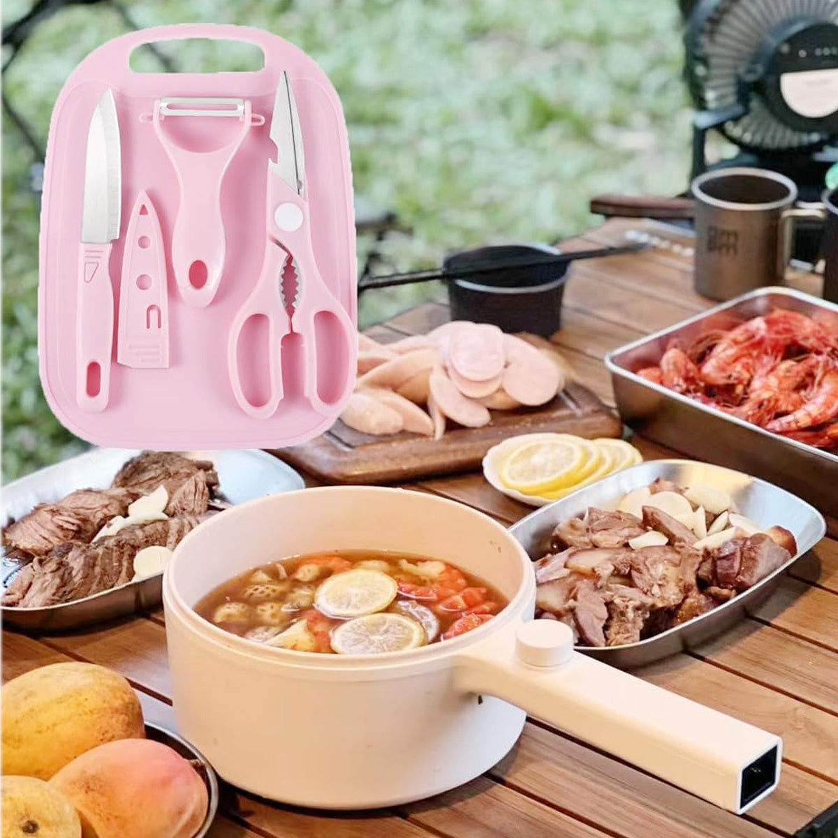 A pink cutting board set is shown with various cooked foods like meat and soup on a wooden outdoor table.