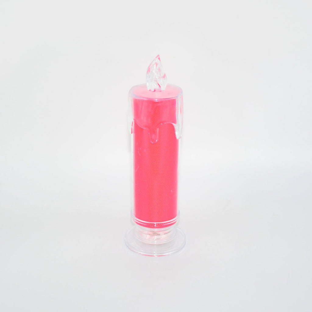 A pink LED glitter candle with a clear base and flame-shaped top, unlit against a white background.