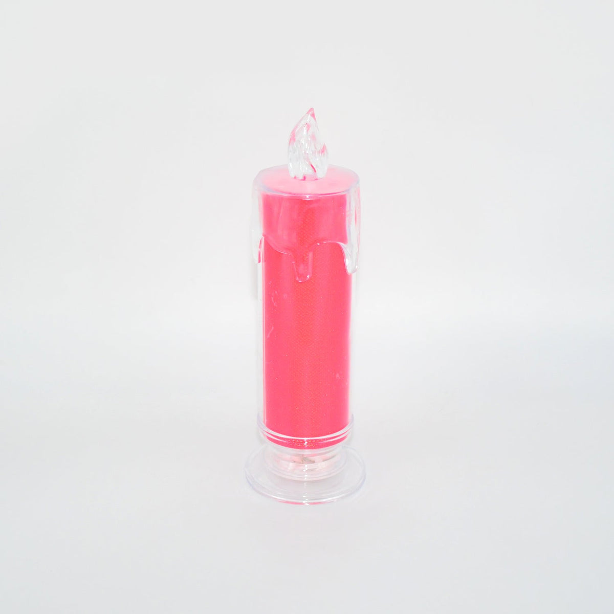 A pink LED glitter candle with a clear base and flame-shaped top, unlit against a white background.