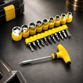 A 21-piece T-shape ratchet socket set with yellow handles and silver bits, on a dark background.