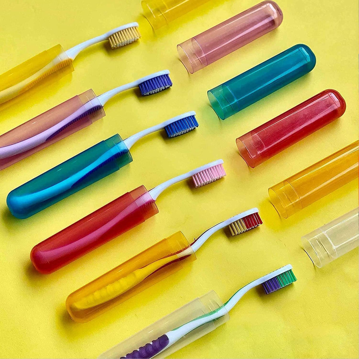 Multiple colorful toothbrushes are shown partially inserted into matching translucent cases on a bright yellow background.