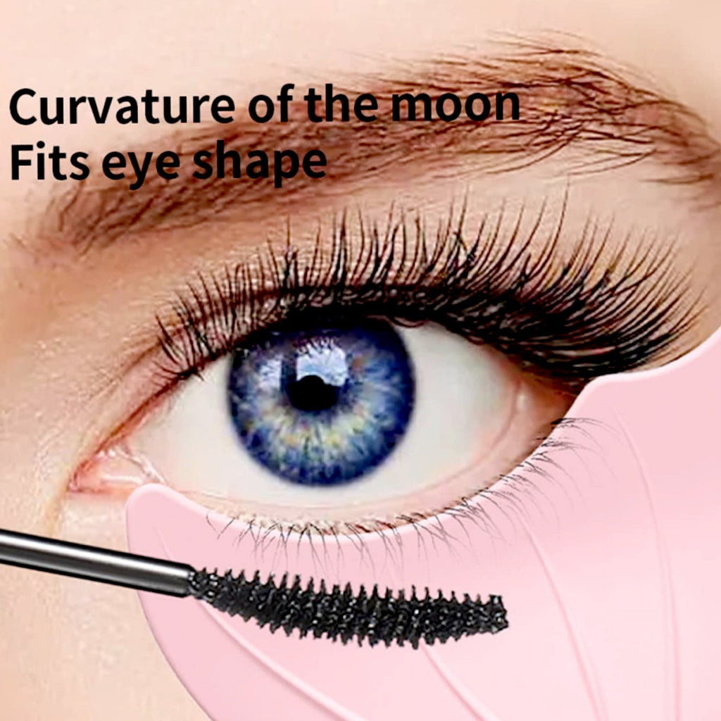 A close-up of a blue eye with a mascara wand and a pink silicone guide, demonstrating its curved shape for eye fit.