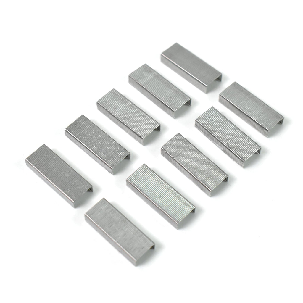 Ten silver staple strips arranged in two rows on a white background, ready for a mini stapler.