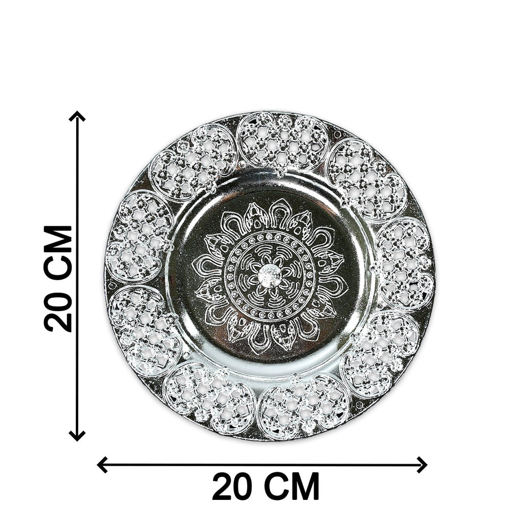 A silver-colored plastic pooja thali with embossed details, marked with arrows indicating its 20 cm diameter.