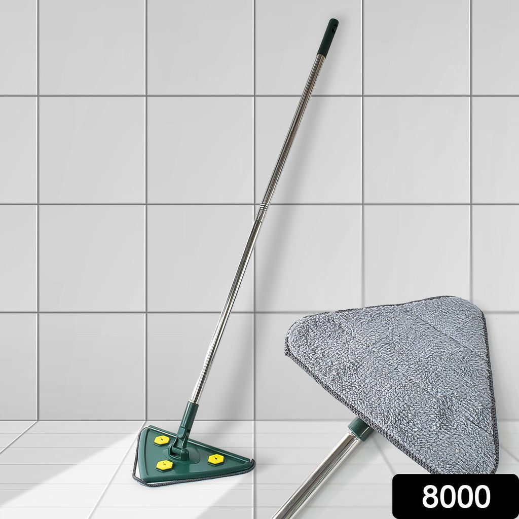A green triangle mop with a silver handle stands against a white tiled wall, with a close-up of its gray microfiber head.