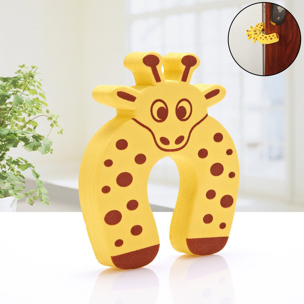 A yellow giraffe-shaped EVA door stopper with brown spots stands on a white surface with a plant in the background.