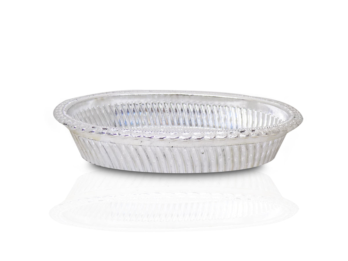 A silver oval decorative serving tray with a floral pattern on a white background, viewed from the side.
