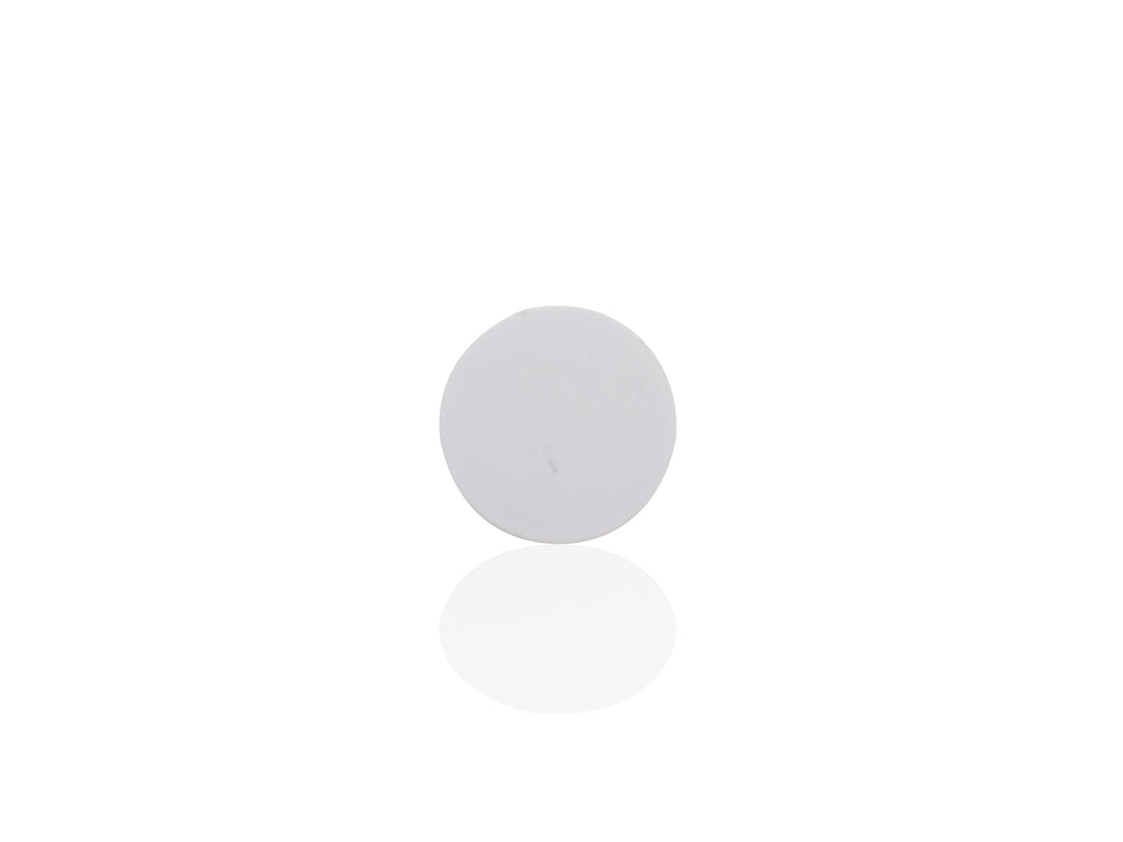 A single white phone grip is shown in its collapsed, flat state on a reflective white surface.