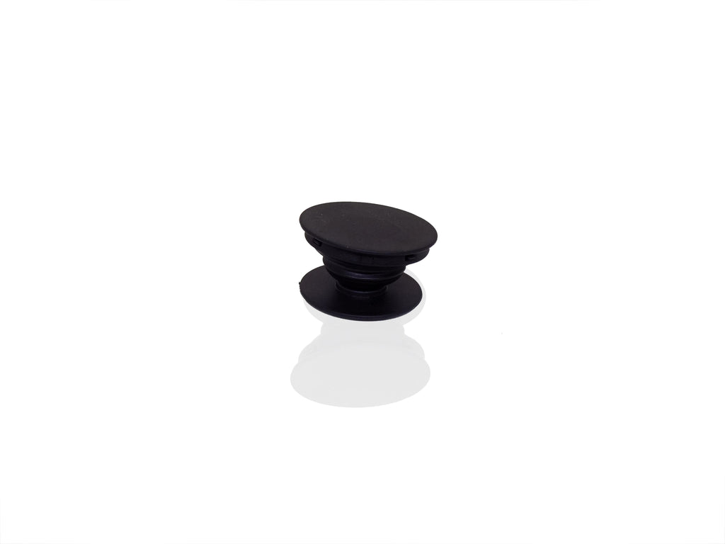 A single black phone grip is shown in its expanded state on a reflective white surface.
