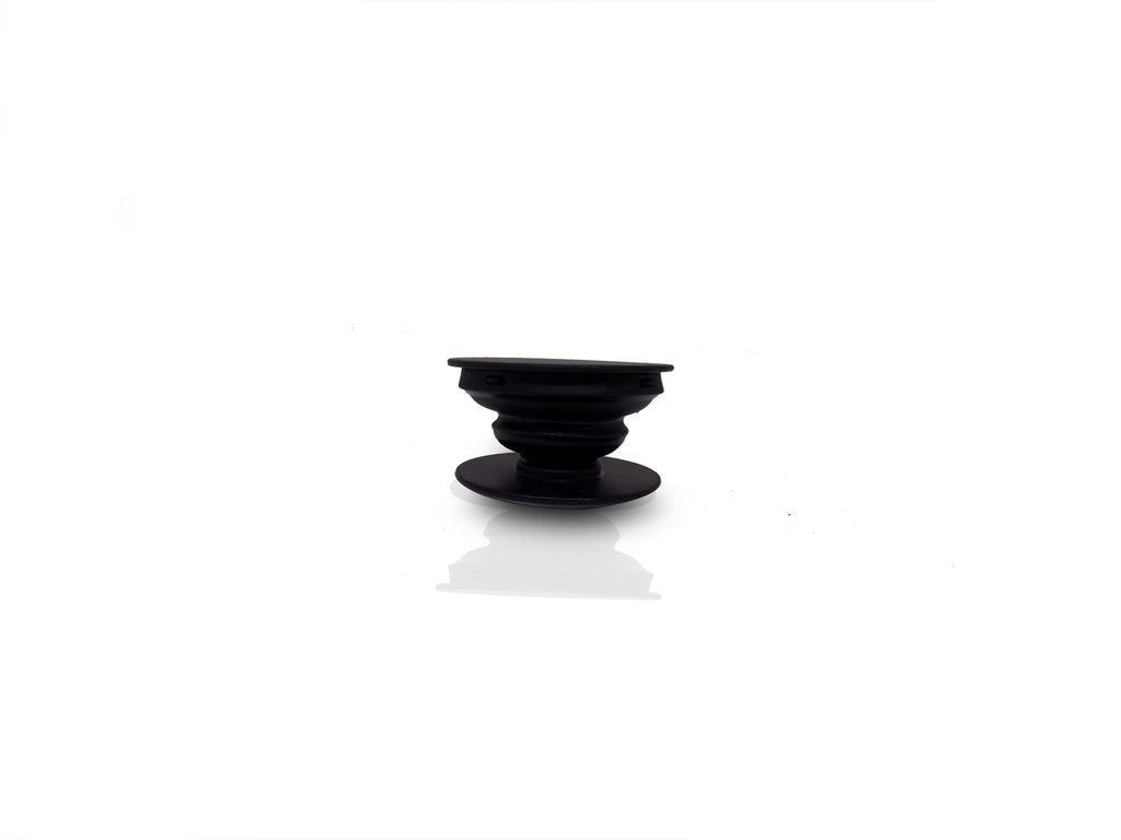 A black phone grip is shown fully expanded, showcasing its ribbed, collapsible design.
