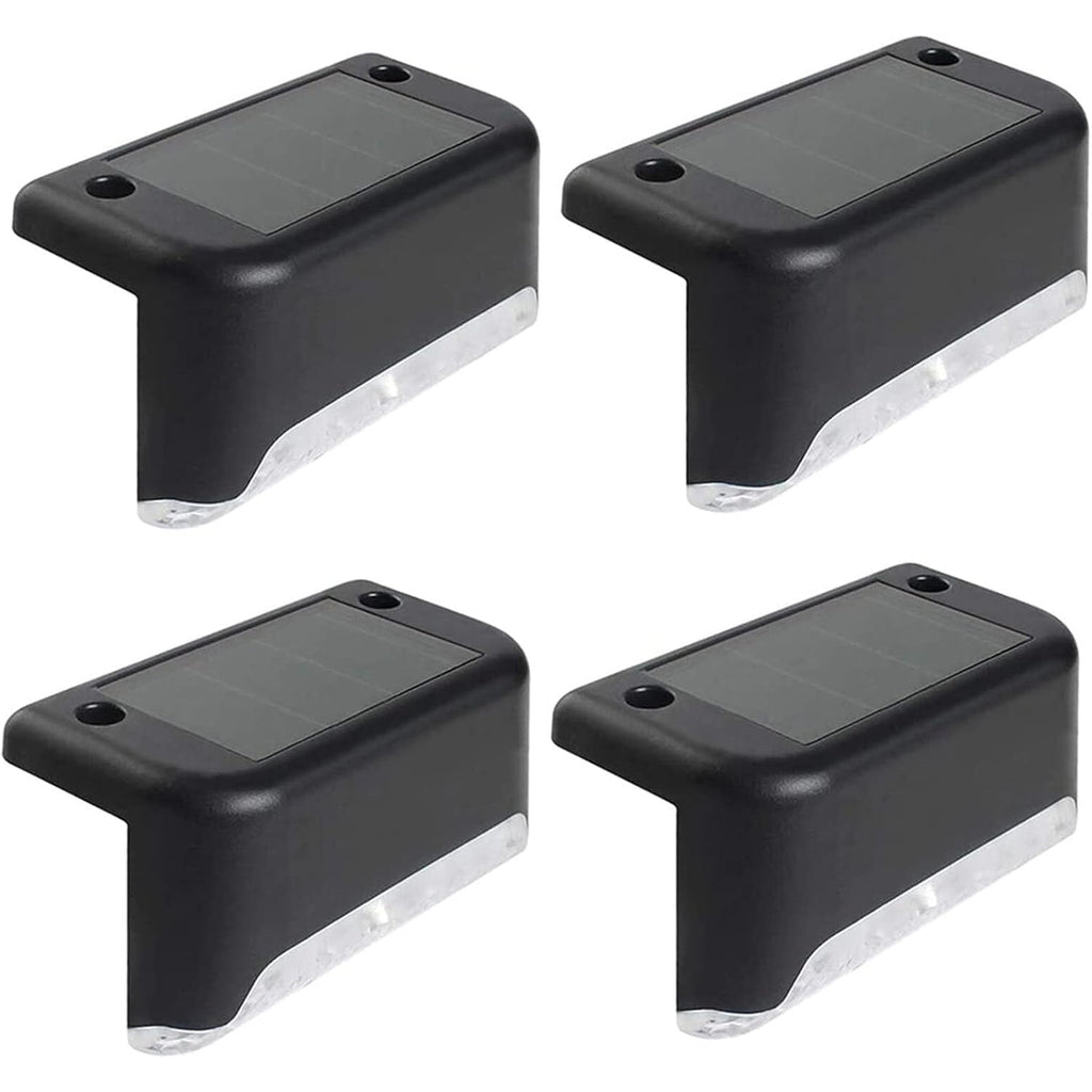 Four black solar-powered step lights with clear plastic diffusers are arranged on a white background.