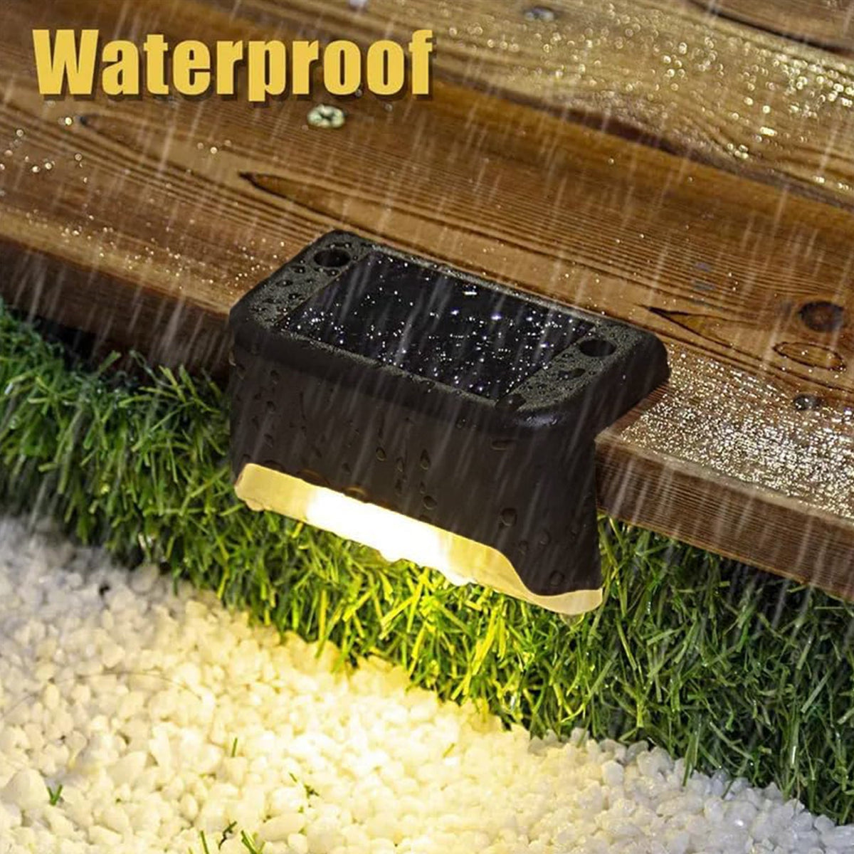 A black solar light on a wooden deck is shown with simulated raindrops and a glowing light below.