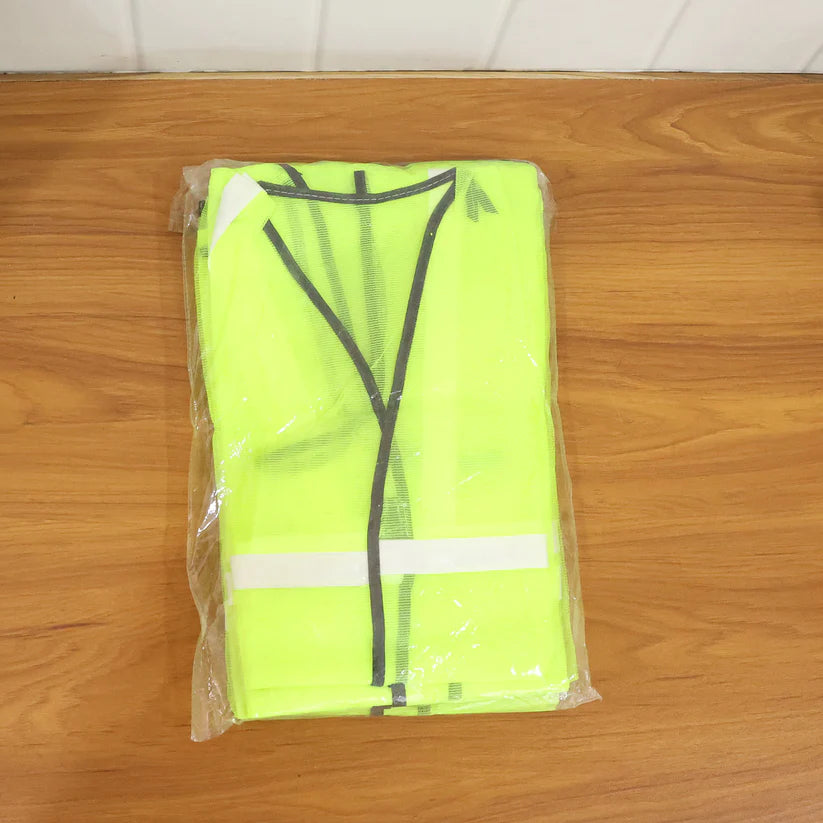 Green Safety Jacket For Having Protection Against Accidents Usually In Construction Areas. - 7437