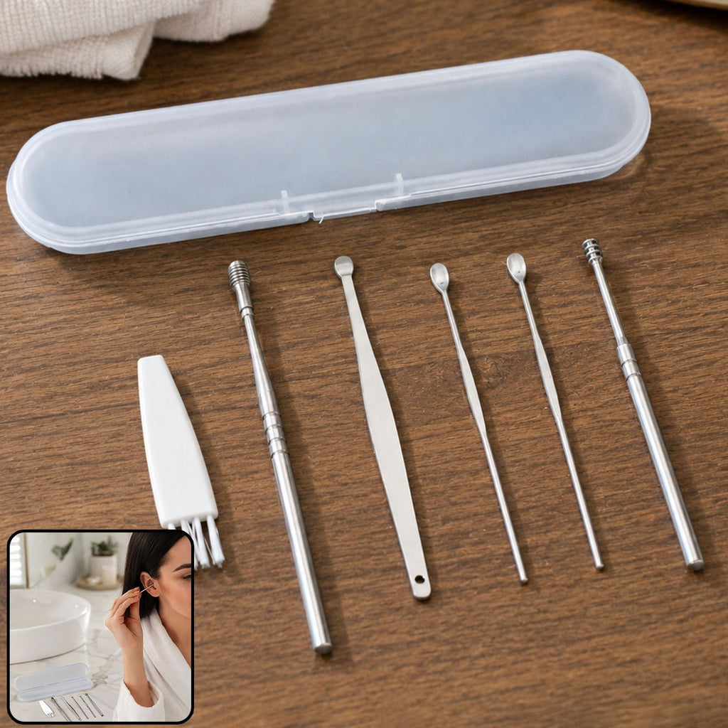 A clear case and six silver ear cleaning tools, including a brush, are arranged on a wooden surface.