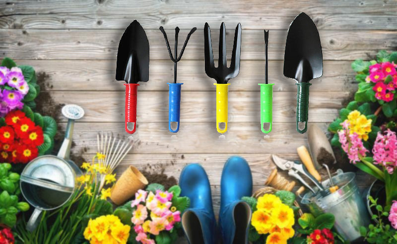 Five mini gardening tools are displayed above a rustic wooden background with various gardening items and colorful flowers.