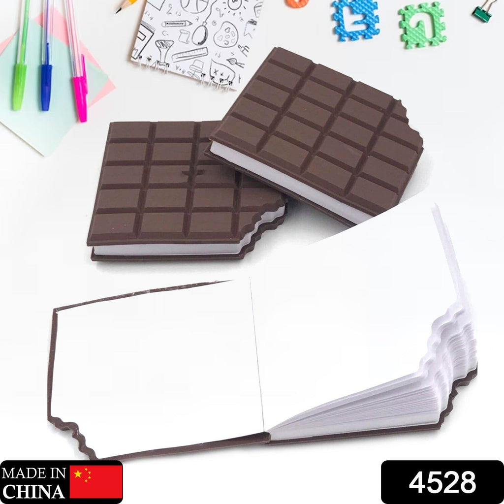 Three chocolate bar shaped notebooks on a white surface with pens and other stationery items.