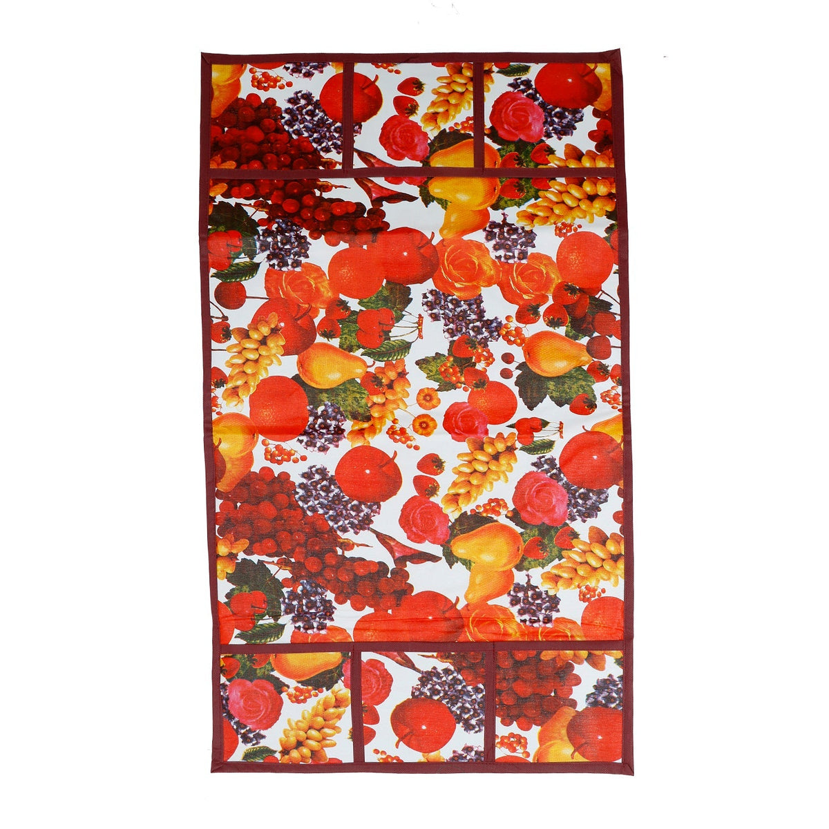 A flat lay of the fruit-patterned refrigerator top cover, showcasing its full design and pockets.